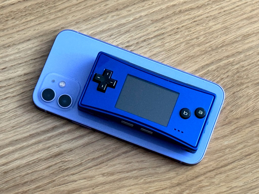 A Game Boy Micro on top of an iPhone
