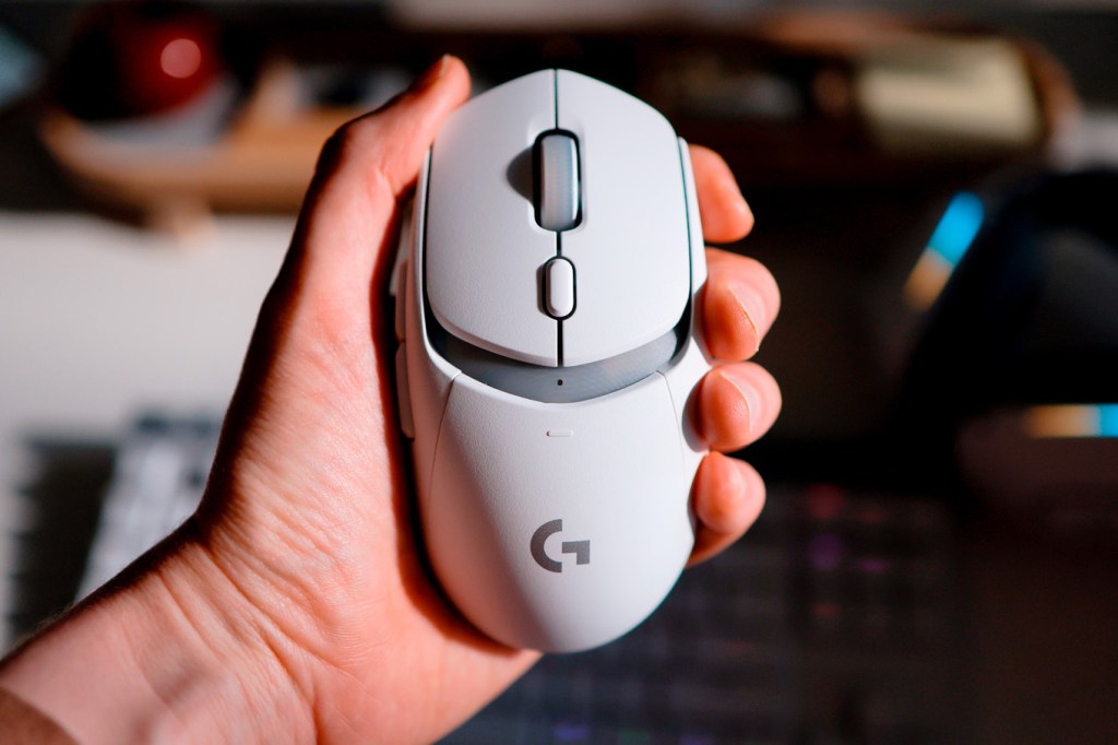 Logitech G309 gaming mouse in hand