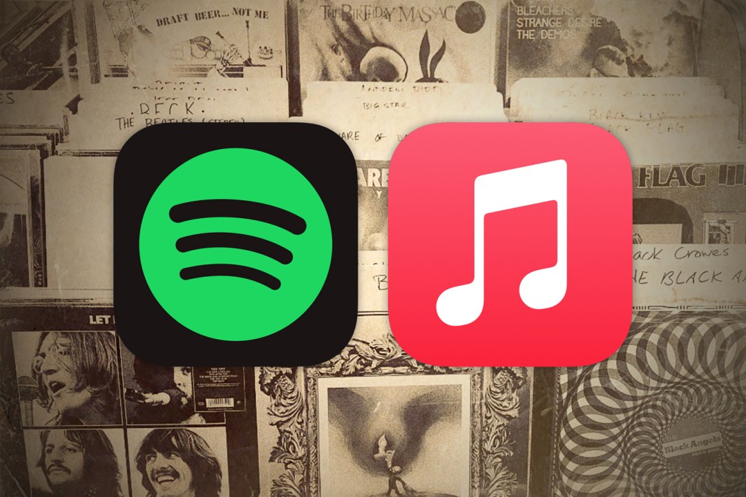 Spotify and Apple Music music streaming service logos atop old photo of albums for sale, making us wonder about the future of music