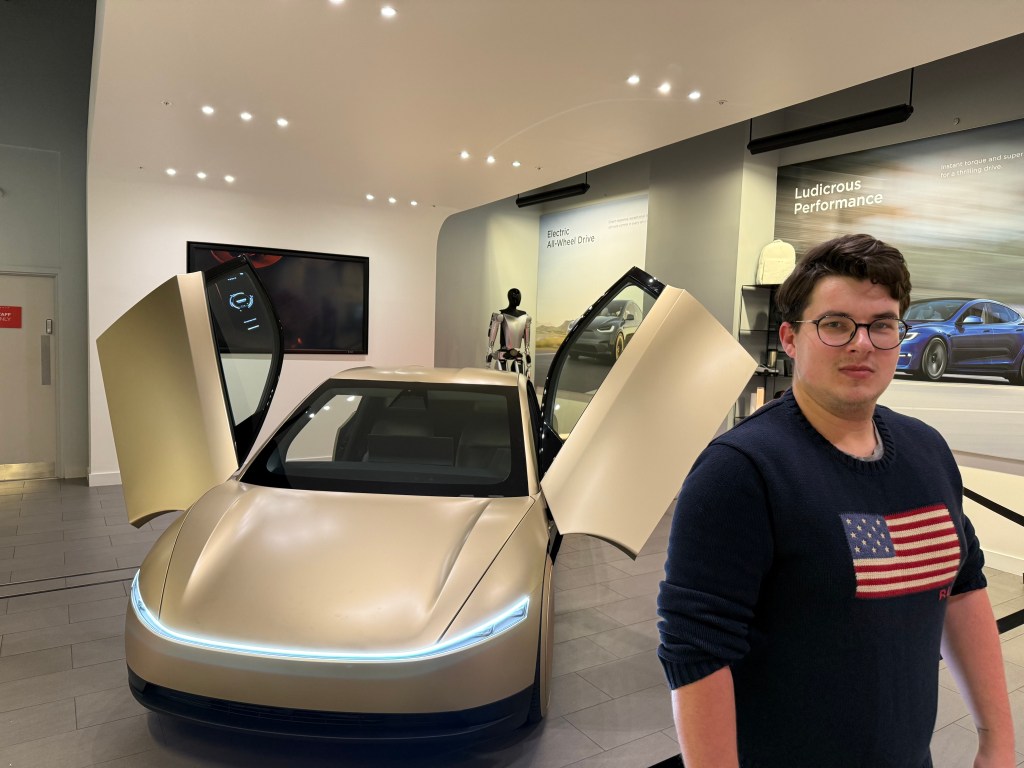 Me next to the Tesla Cybercab