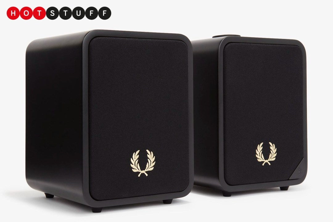 A pair of black Ruark Audio x Fred Perry MR1 speakers on a white background.