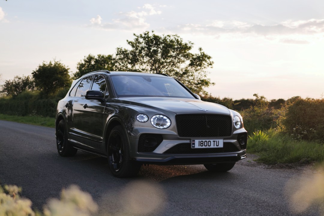 Green Bentley Bentayga on country road