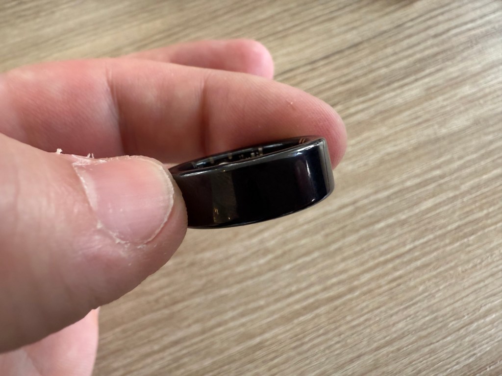 Infinx smart ring being held